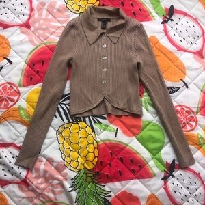 Brown cropped cardigan with button-up front and long sleeves